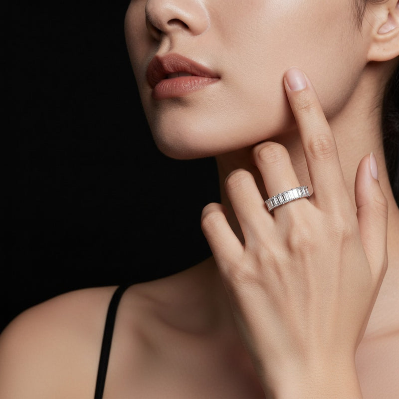 Model wearing emerald lab grown diamond split prong eternity ring