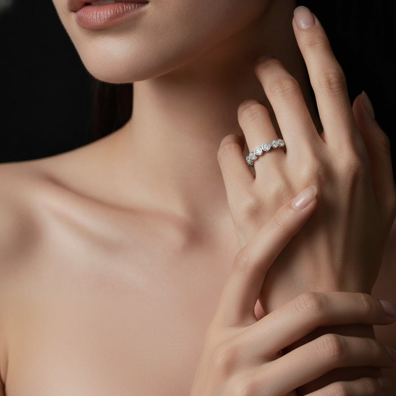 Model wearing round eternity band ring