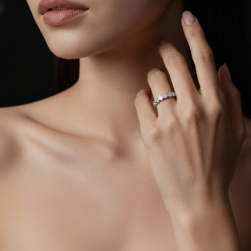 Model wearing round eternity band ring