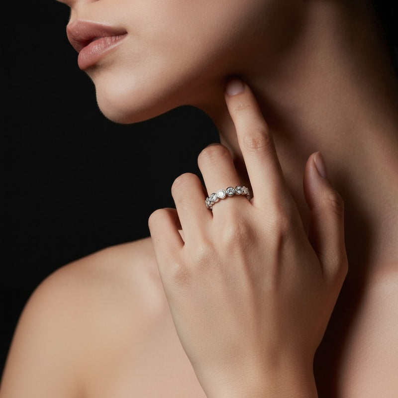 Model wearing round eternity band ring