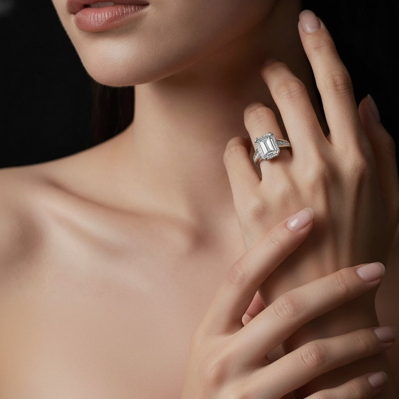 Model wearing emerald ring