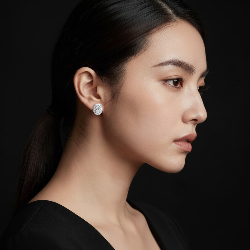 Model wearing oval halo stud earrings