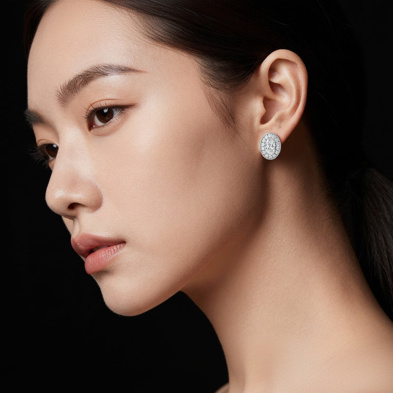 Model wearing oval halo stud earrings