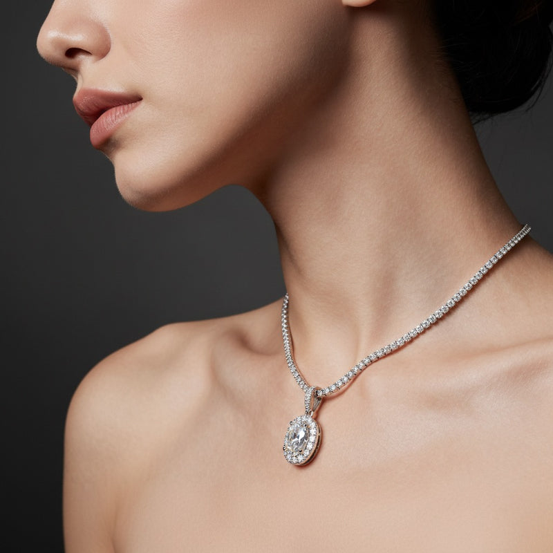 Model wearing oval halo pendant