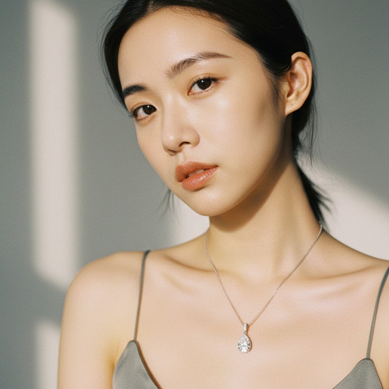 Model wearing pear halo pendant