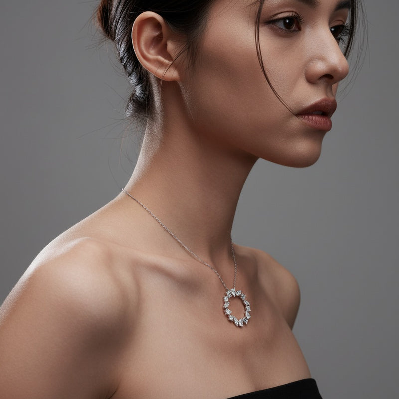 Model wearing emerald fancy circle pendant
