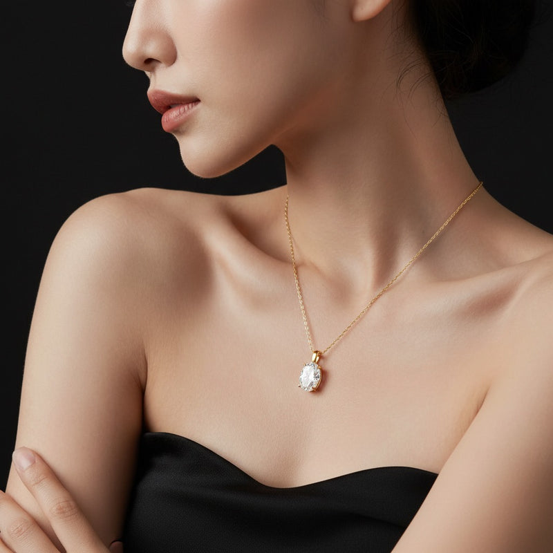 Model wearing oval split bale solitaire pendant