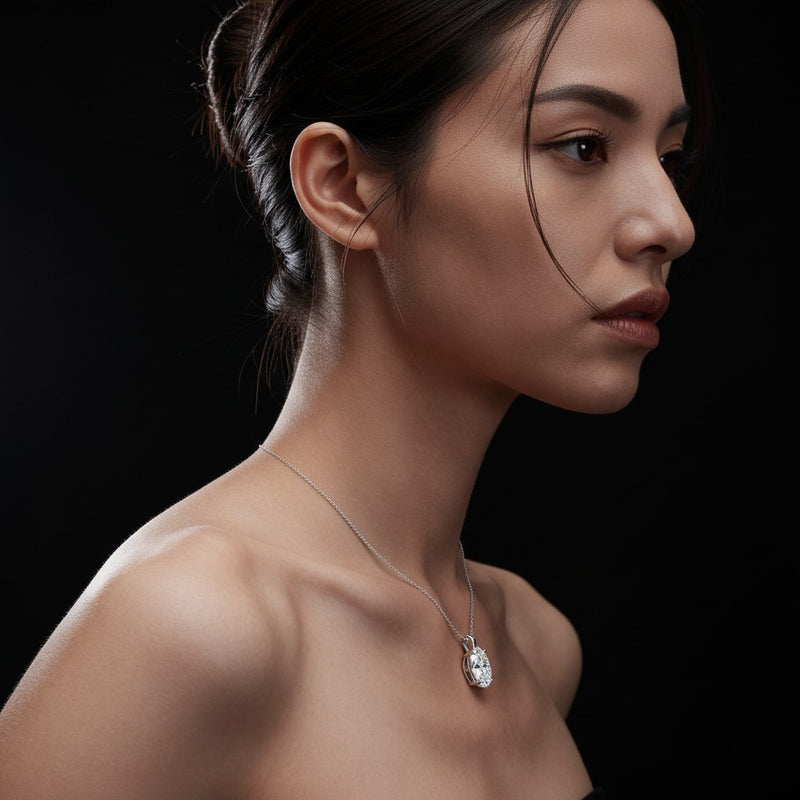 Model wearing oval split bale solitaire pendant