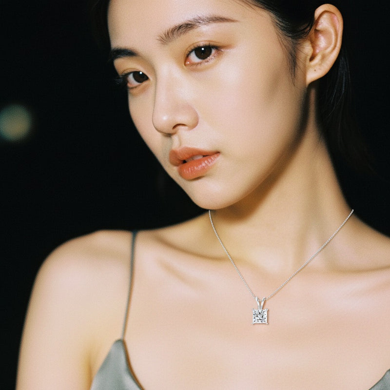 Model wearing princess split bale solitaire pendant