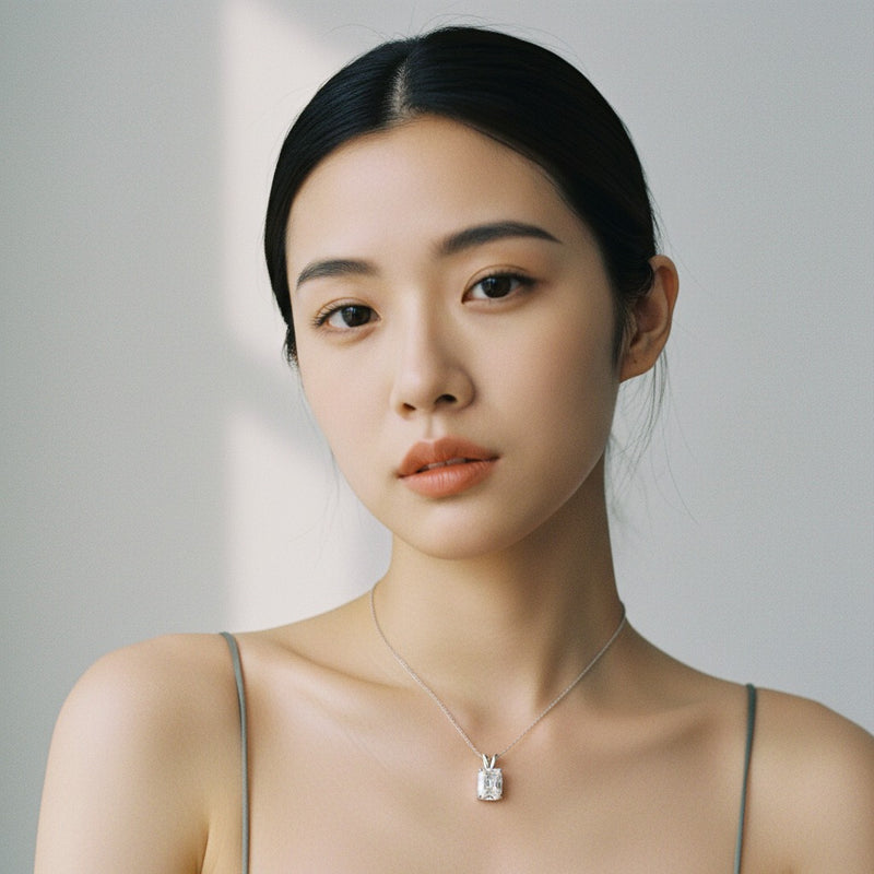 Model wearing cushion solitaire pendant