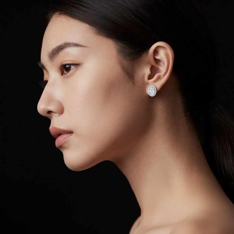 Model wearing oval halo stud earrings