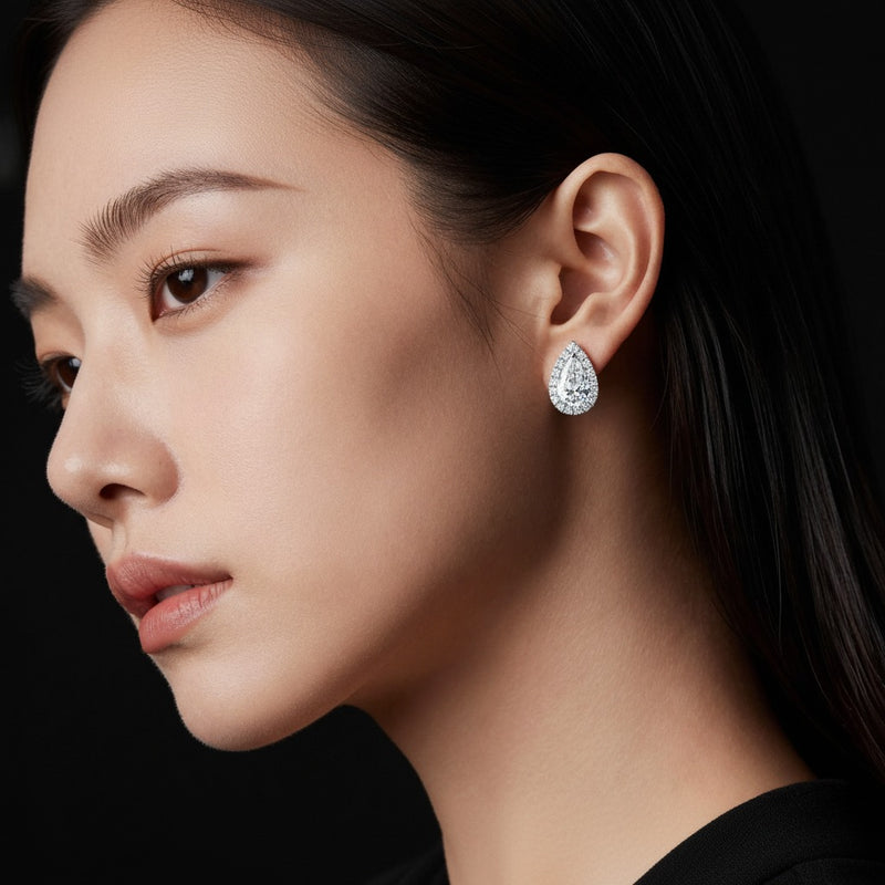 Model wearing pear halo stud earrings