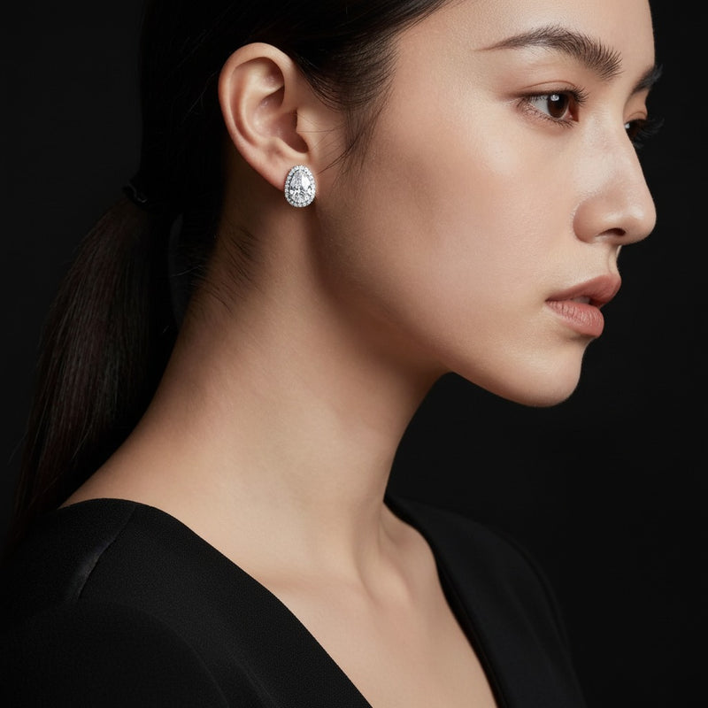 Model wearing pear halo stud earrings