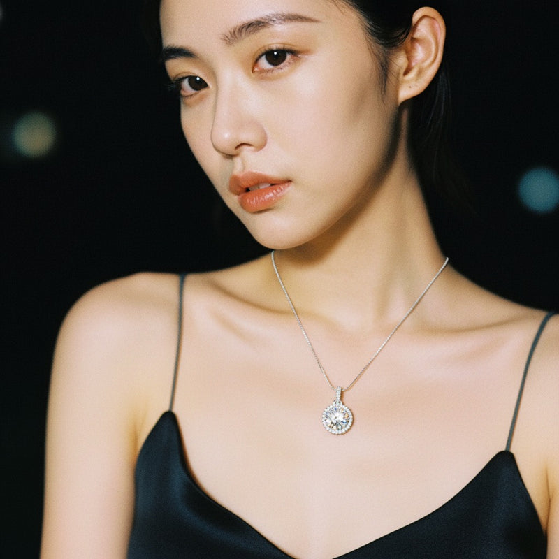 Model wearing round halo pendant