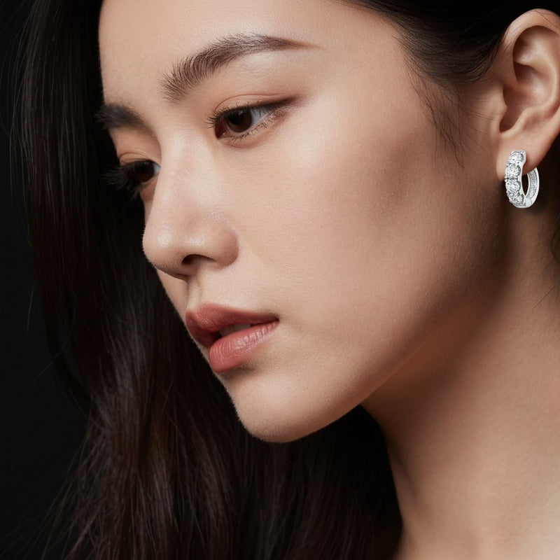 Model wearing round hoop earrings