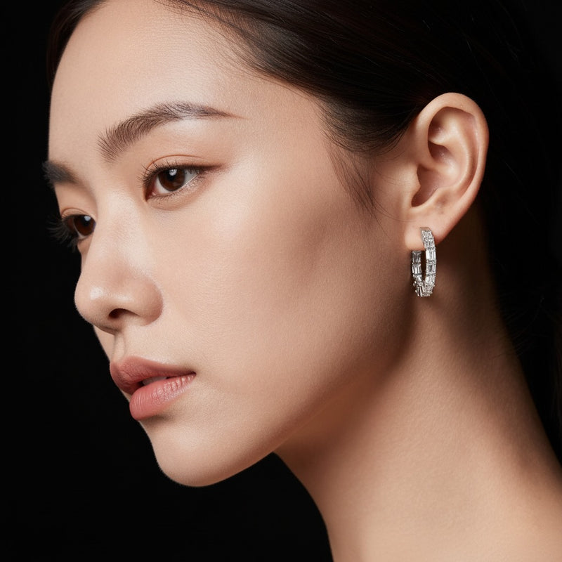 Model wearing emerald inside out hoop earrings