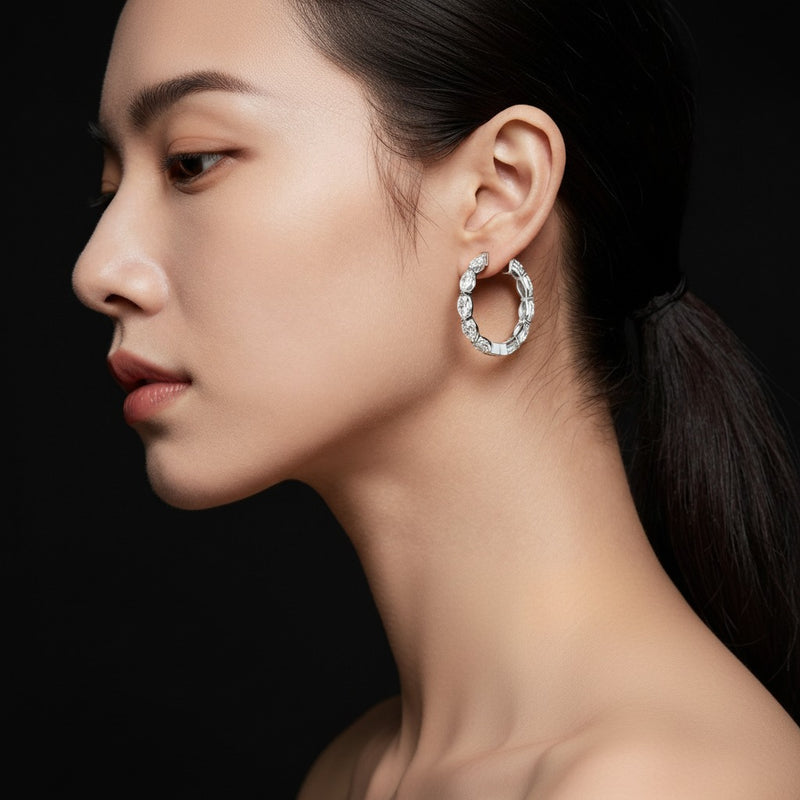 Model wearing marquise inside out hoop earrings