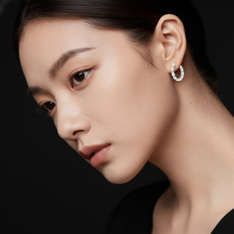 Model wearing marquise inside out hoop earrings