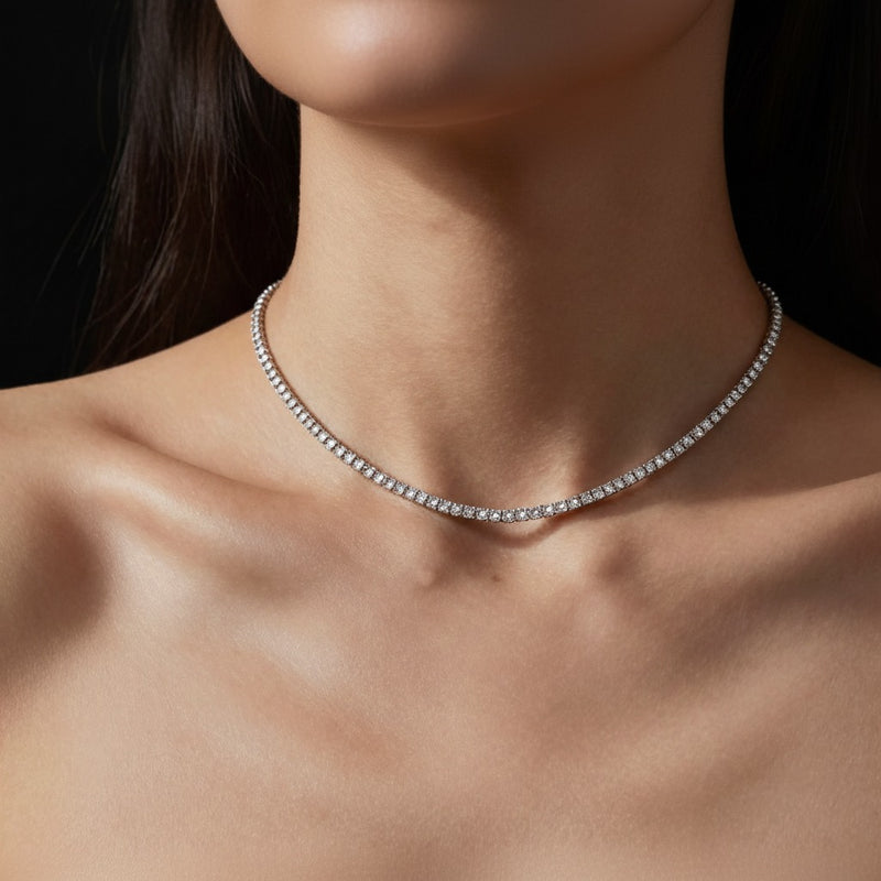 Model wearing round graduating half riviera necklace