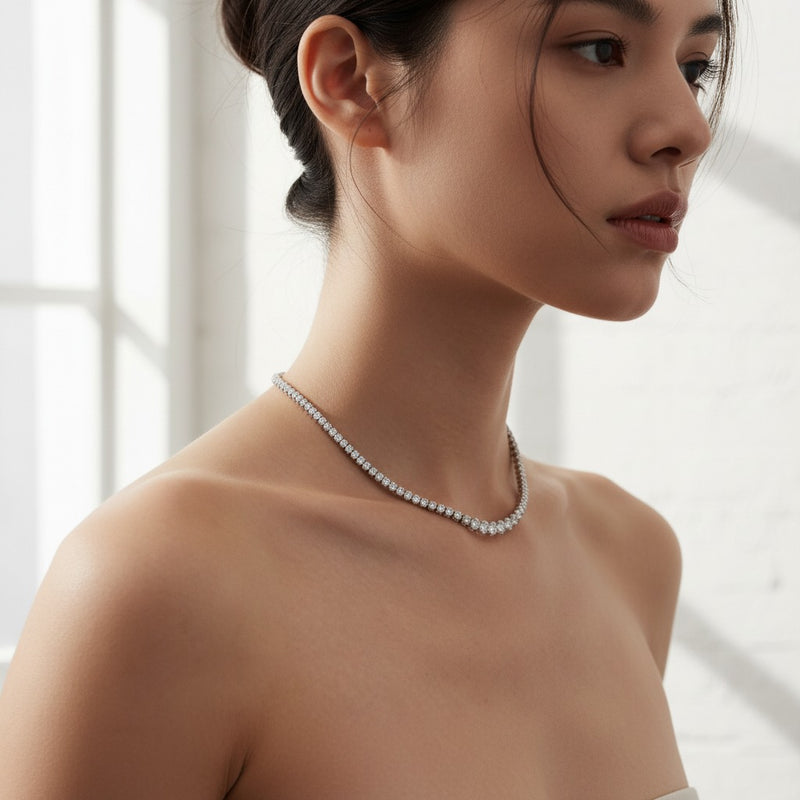 Model wearing round graduating half riviera necklace
