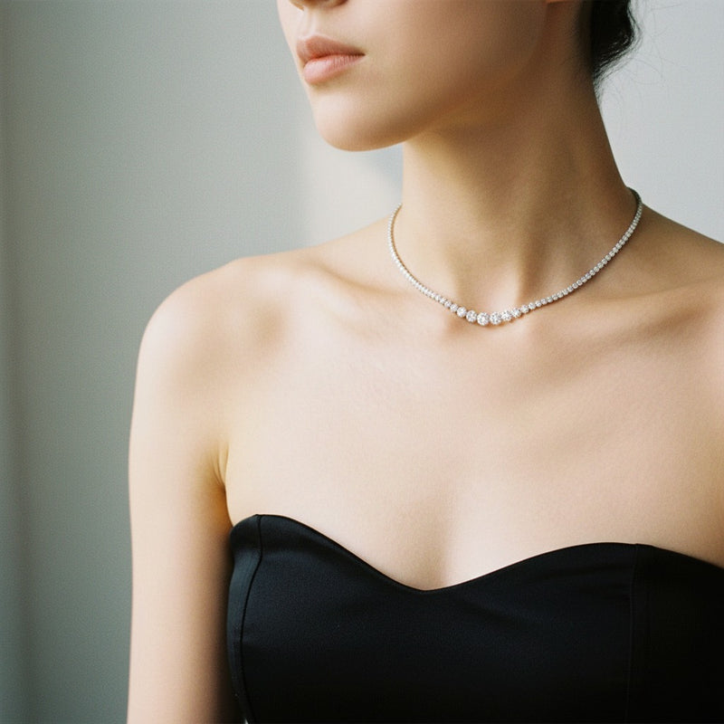 Model wearing round graduating full riviera necklace
