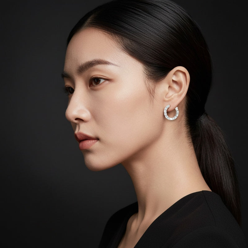 Model wearing round inside out hoop earrings