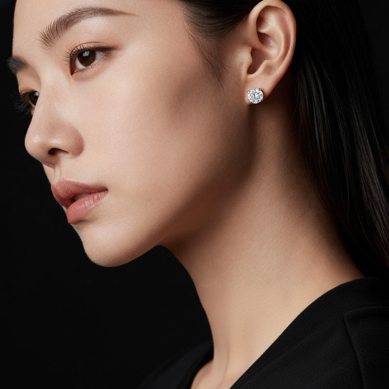 Model wearing round stud earrings