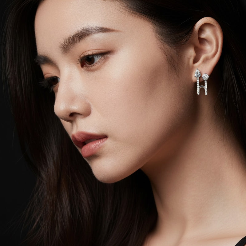 Model wearing round toi et moi accented earrings