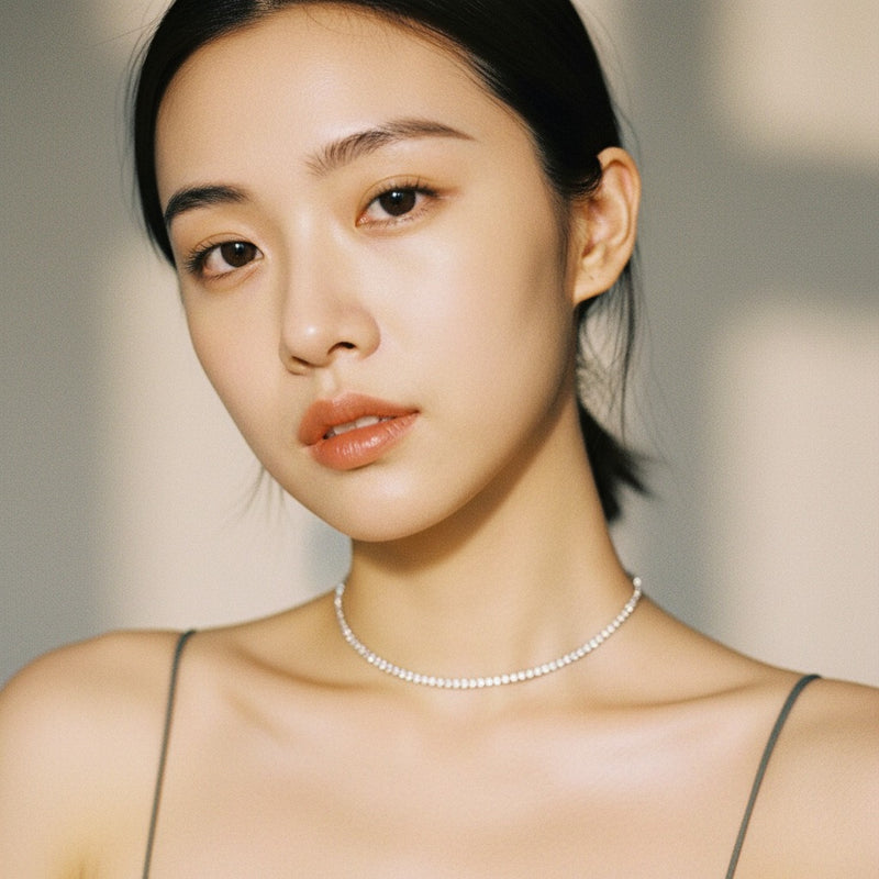 Model wearing round tennis necklace