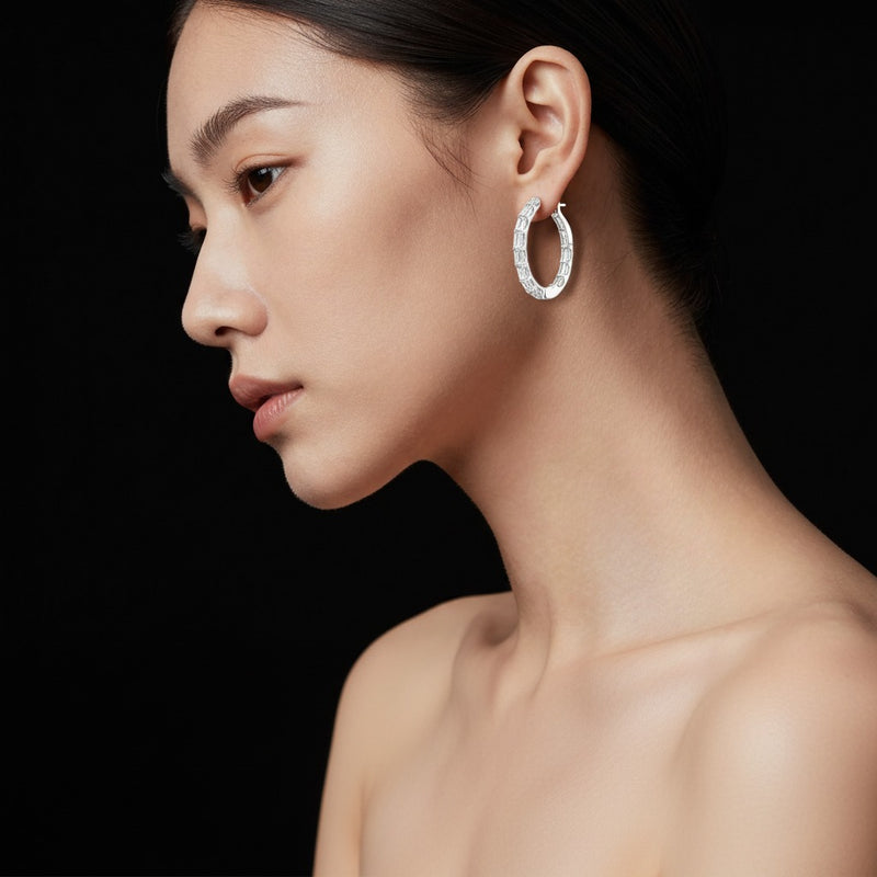 Model wearing emerald inside out hoop earrings