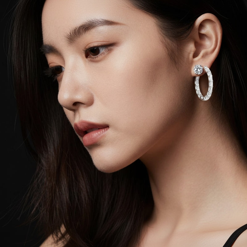 Model wearing emerald inside out hoop earrings