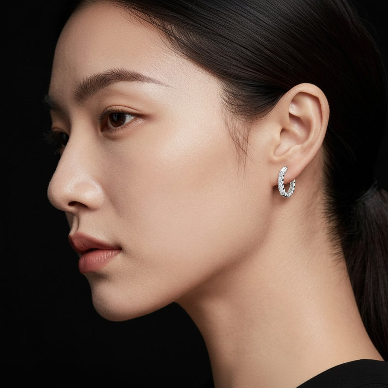 Model wearing round inside out hoop earring