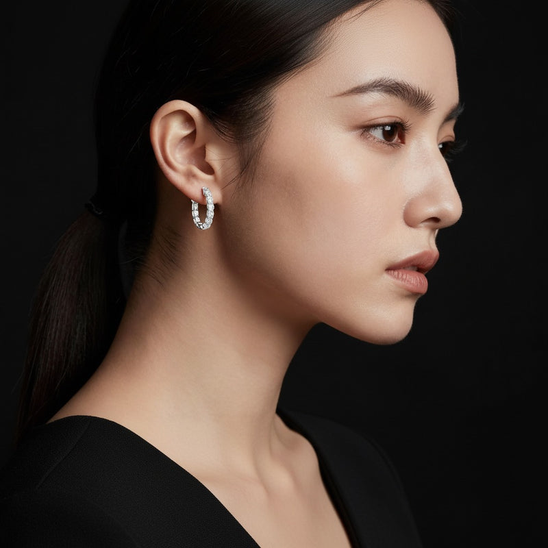 Model wearing round inside out hoop earrings