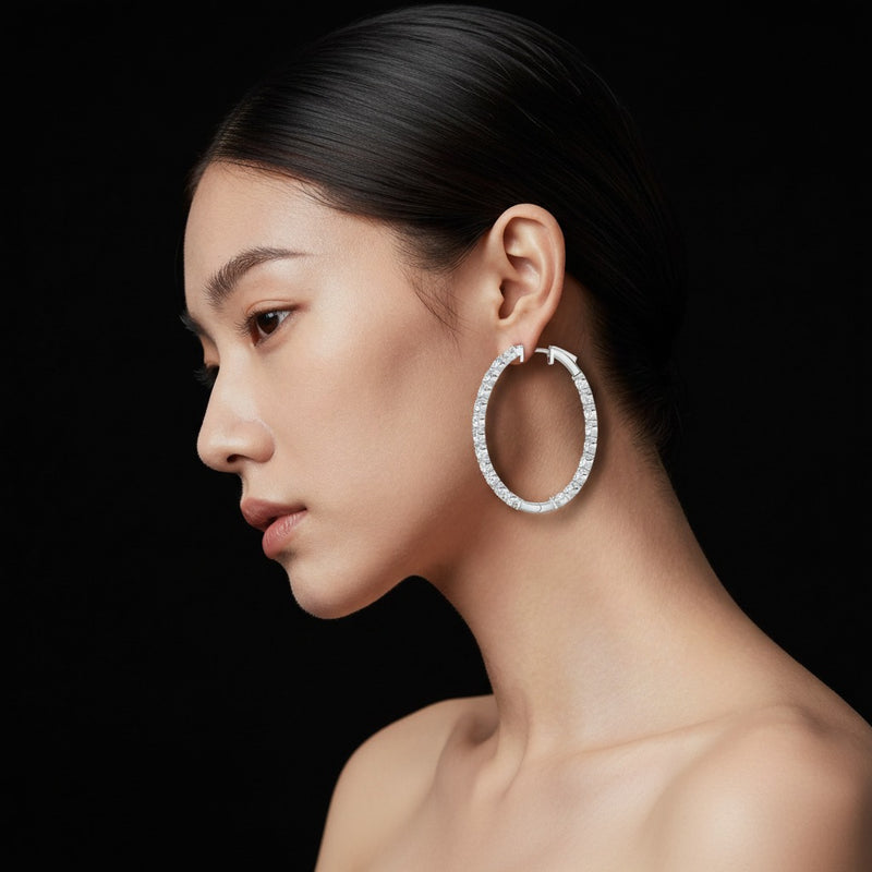 Model wearing round inside out hoop earrings
