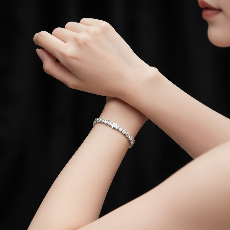 Model wearing emerald tennis bracelet