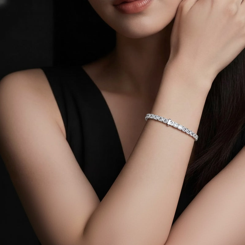 Model wearing emerald tennis bracelet
