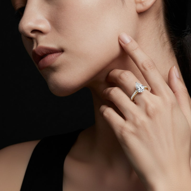 Model wearing pear two tone accented rope design engagement ring