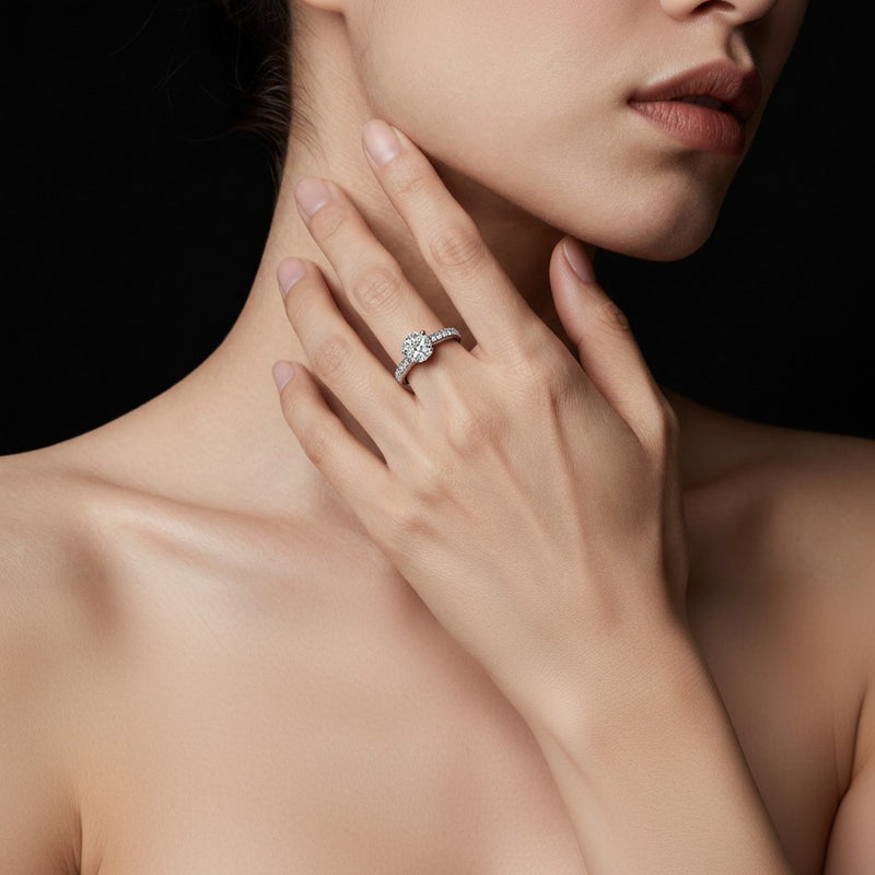 Model wearing oval accented milgrain engagement ring