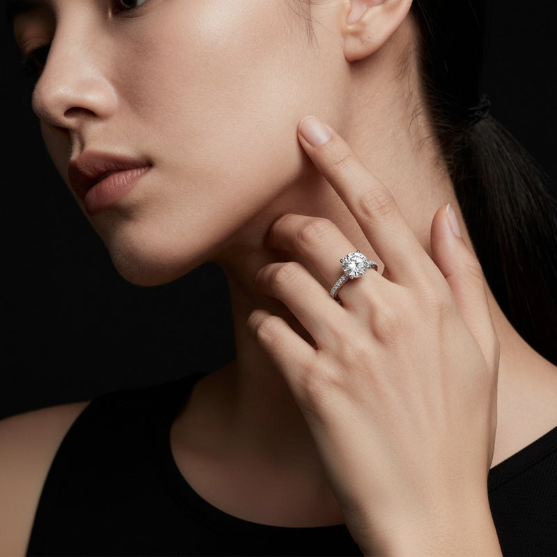 Model wearing round accented engagement ring