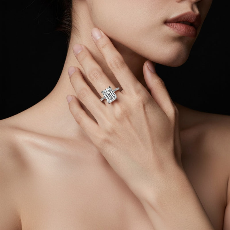 Model wearing emerald triple row accented engagement ring