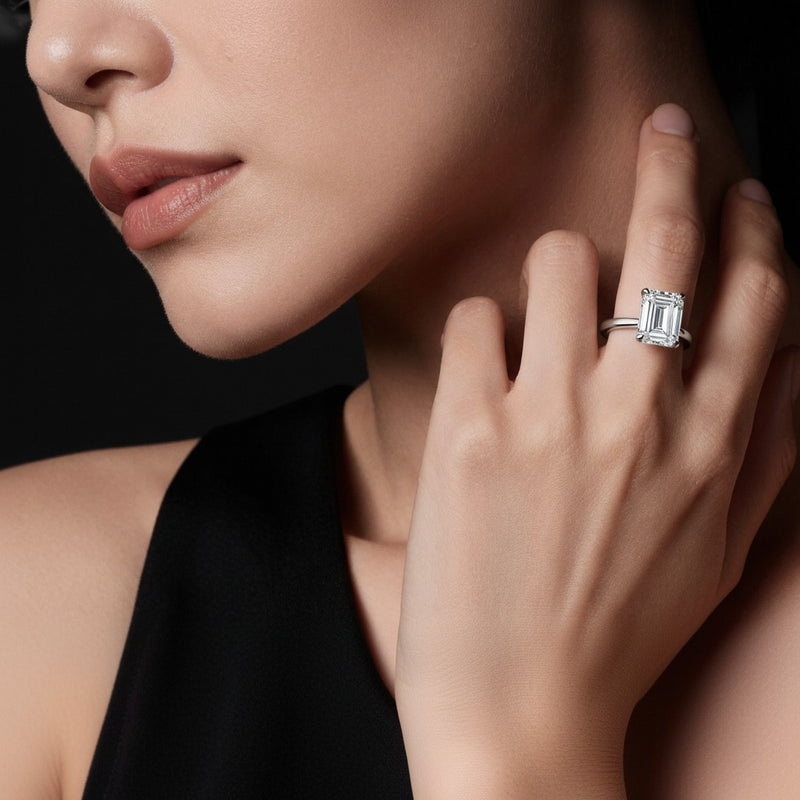 Model wearing cushion hidden halo plain shank engagement ring