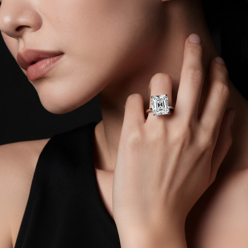 Model wearing cushion hidden halo plain shank engagement ring