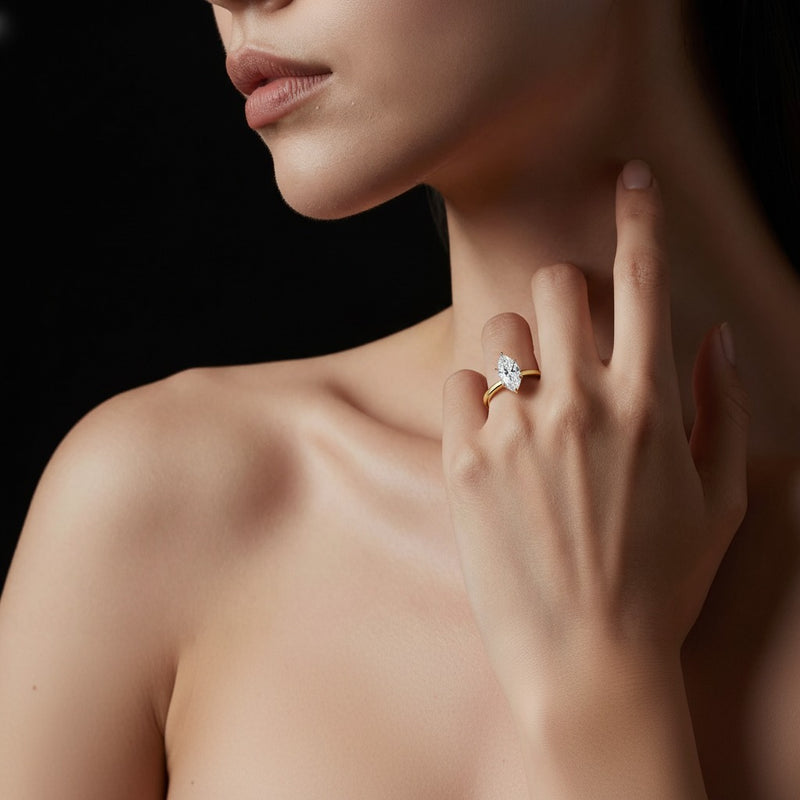 Model wearing marquise hidden halo plain shank engagement ring