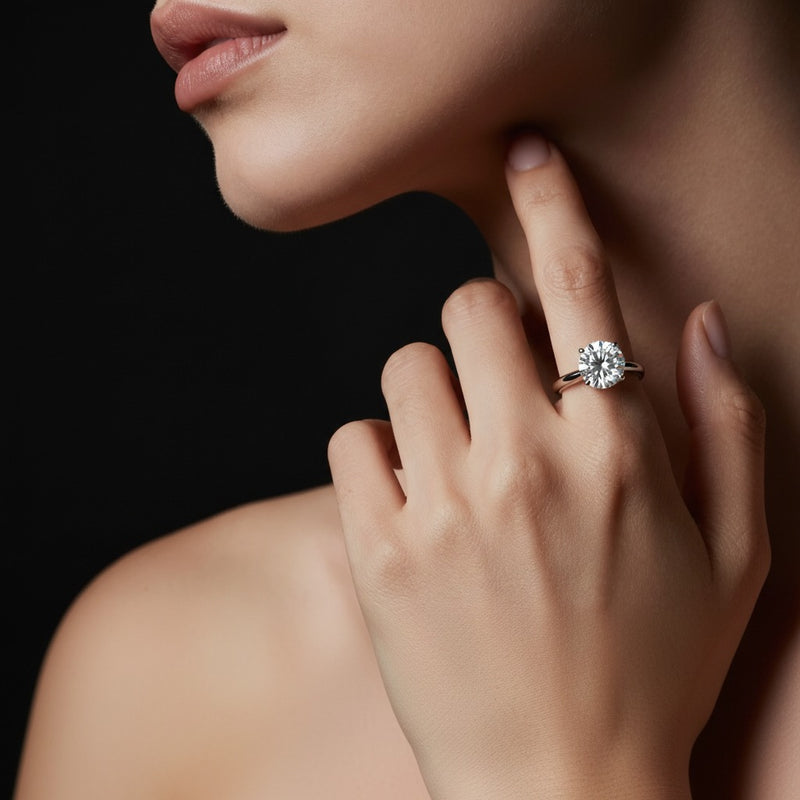 Model wearing round hidden halo plain shank engagement ring