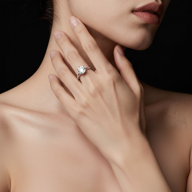 Model wearing round hidden halo plain shank engagement ring