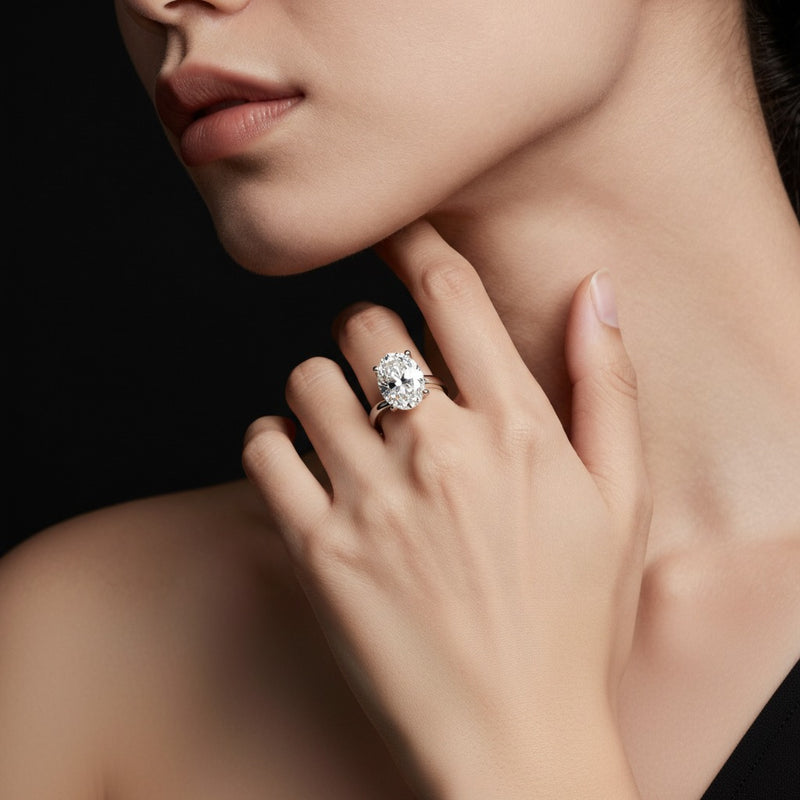 Model wearing oval bypass shank engagement ring