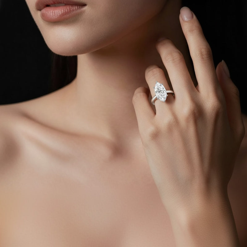 Model wearing marquise hidden halo cathedral shank engagement ring