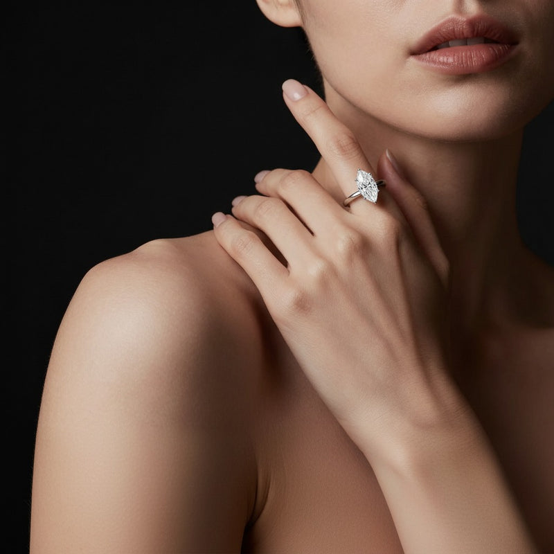 Model wearing marquise hidden halo cathedral shank engagement ring