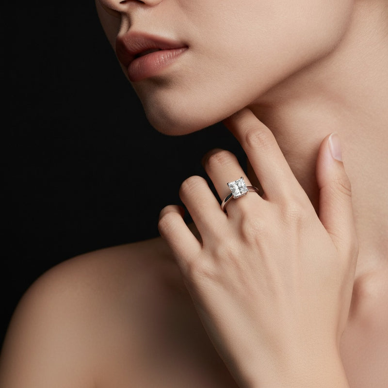 Model wearing princess hidden halo cathedral shank engagement ring
