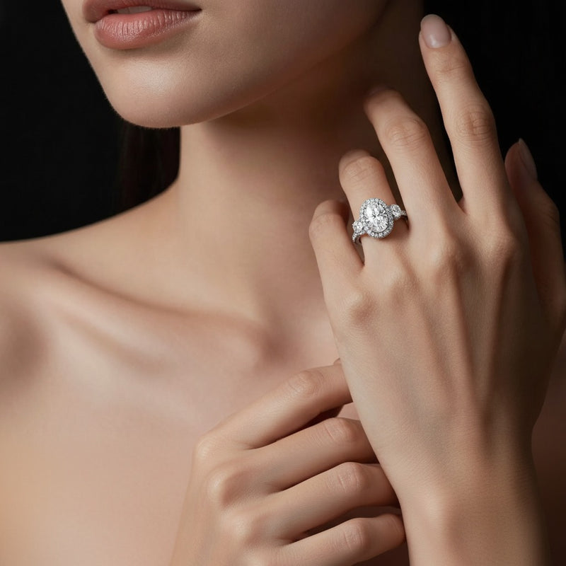 Model wearing oval three stone accented ring